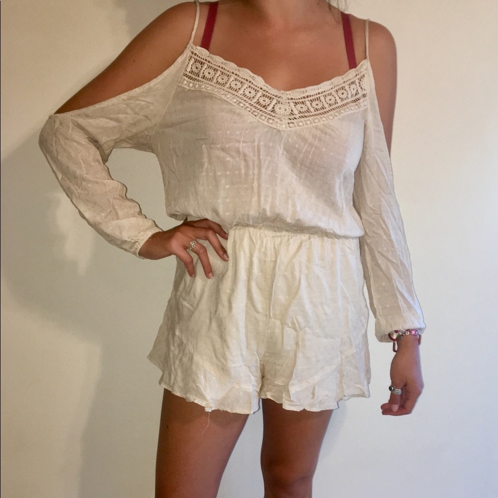 ecote cream colored romper with lace neck/back